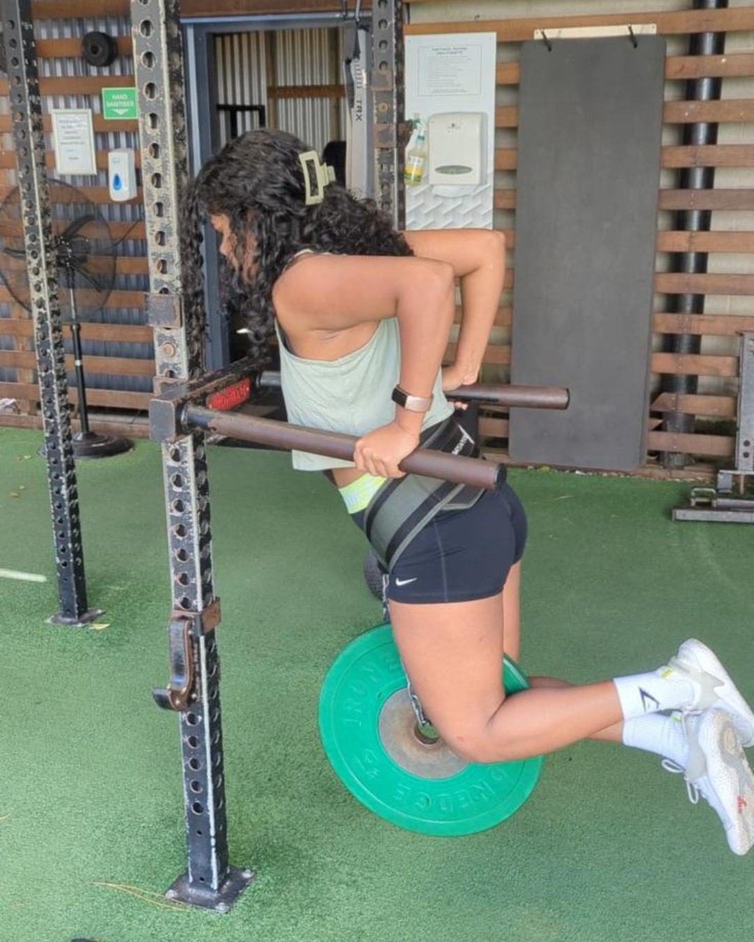 Jana doing pull-ups or mobility work
